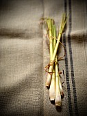 Fresh lemongrass on a linen cloth