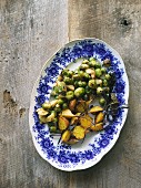 Oven roasted vegetables (brussels sprouts, parsnips, yellow beets), on a serving platter