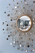 Round mirror reflecting elegant interior