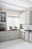 White, Scandinavian country-house kitchen with vintage ambiance