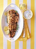 Salmon fillet with herb butter, lemons and dill yoghurt