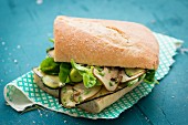 Ciabatta sandwich with roasted vegetables, mushrooms and lettuce