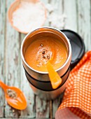Carrot soup in an insulated container