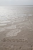 In Sand geschriebene Botschaft