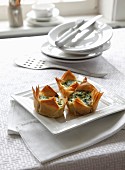 Strudel pastry baskets with spinach