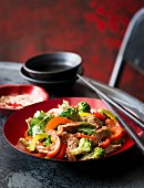 Stir-fried beef with vegetables and sesame seeds