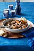 Beef stew with carrots, celery, onions and mushrooms