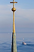 The spire of the Minster of Constance with a view of Lake Constance
