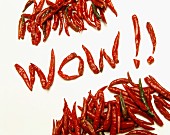 The word 'Wow!!' spelt using dried, red chilli peppers