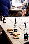 Burgers with cola on a wooden table