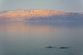 Two tourists bathing in the dead Sea