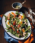 White bean salad with olives and rocket