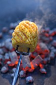 Grilled pineapple on a fork