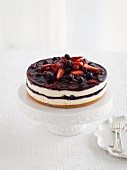 Cheesecake with berries on a cake stand