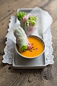 Vegan Vietnamese spring rolls filled with a carrot dip