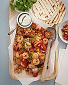 Tacos with tomatoes, sweetcorn and prawns