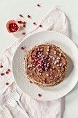 Crepes cake with pomegranate seeds