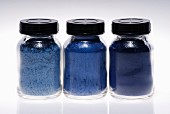 Small jars of blue make-up