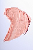 Light-pink lipstick on a white surface