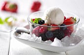 A scoop of lemon sorbet on mixed berries