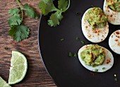 Devilled eggs with avocado cream (seen from above)