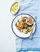 Sate skewers with grilled aubergines and courgettes