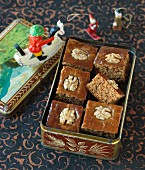 Gingerbread cake with walnuts in a tin