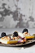 Blackberries with walnuts and acacia honey on manchego cheese