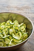 Courgette tagliatelle in a stainless steel bowl