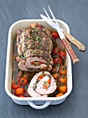 Stuffed pork loin roulade with ratatouille, herbs and cherry tomatoes