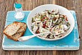 Herring salad with gherkins, chilli, onions and dill served with bread