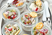 Herring salad with gherkins, chilli, onions and dill served with crackers