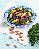 Kale salad with oranges and salted almonds