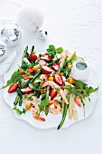 Prawn salad with asparagus, strawberries, physalis and a coconut dressing
