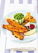 Fish fingers with potato wedges and peas