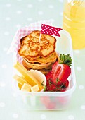 Pancakes with cheese sticks and strawberries