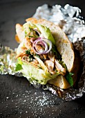 Chicken donner with lettuce and onions as a takeaway