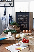 Chopping board, vegetables and eggs on wooden table