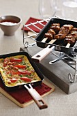 Skewers and omelette in raclette pans