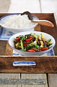 Oriental fried beef with vegetables and sausages