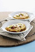 Slices of bread topped with melted Limburg cheese and onions