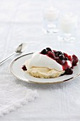 Meringue with cream and red berry compote