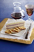 Brie with a cranberry cream filling served with crackers and red wine