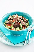 Couscous salad with cucumber, tomatoes and beef