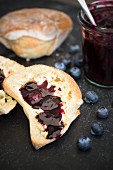 A bread roll with blueberry jam