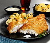 Battered plaice with herb potatoes and tartar sauce