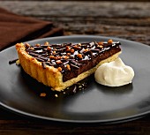 Chocolate and almond tart with cream