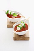 Tomato soup with mozzarella and basil skewers