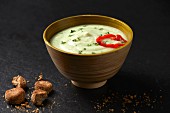 Cauliflower and coconut milk soup with coriander and almond croutons (Paleo diet)