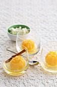 Poached mandarins with cinnamon in dessert glasses